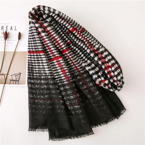 Classic British style black gradient plaid scarf with red accents and tassel detail