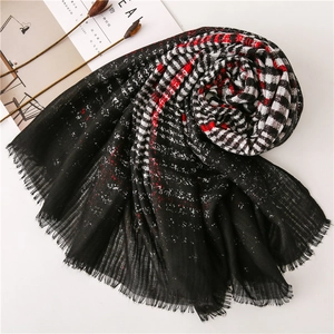 Classic British style black and red plaid scarf with tassel edges and soft fabric