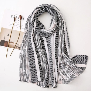 Long cotton linen scarf with black and white geometric H patterns and elegant tassels