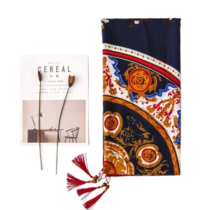 Navy baroque peony scarf with wooden bead tassels and red fringe on white background