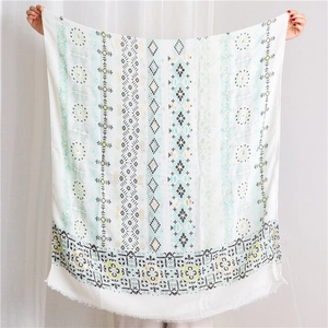 Macro view of Indian style cotton linen scarf with paisley pattern and tassel edges