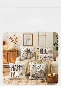 Cozy autumn pumpkin pillows styled on a sofa with warm candles and seasonal decor