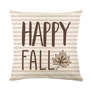 Harvest pumpkin cushion cover with Happy Fall text and maple leaf on striped fabric