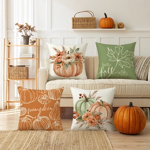 Set of 4 Autumn Harvest throw pillow covers featuring pumpkins and maple leaves on a sofa