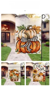 Detail of harvest garden flags with pumpkin and sunflower designs on metal stands