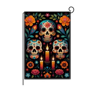 Dia de los Muertos garden flag featuring colorful sugar skulls, marigolds and candles on black