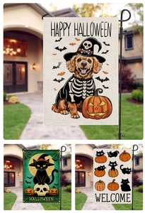 Detail of Halloween garden flags with spooky dog and pumpkin patterns in a yard