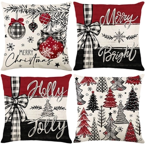 Set of four Christmas pillow covers with festive red plaid and holiday greetings