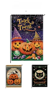 Detailed view of Halloween garden flags featuring pumpkins, black cats, and cobweb designs