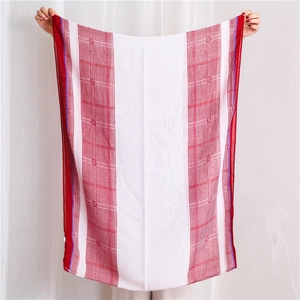 Detail of a thin red and white houndstooth scarf with lightweight breathable fabric texture
