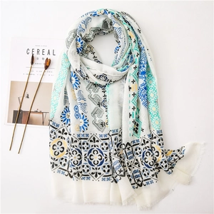 Ethnic paisley gold-stamped cotton linen scarf with tassels for sun protection and beach travel
