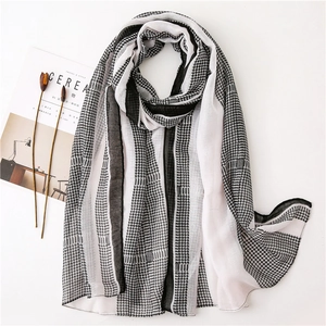 Lightweight black and white houndstooth scarf with stripes on a clean white background