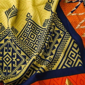Close-up of geometric ethnic pattern on silk shawl with yellow and navy weave texture
