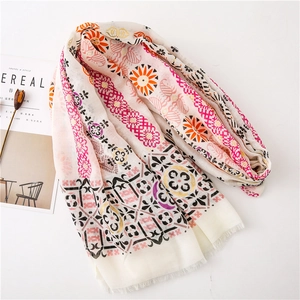 Detail of bohemian cotton linen scarf with paisley pattern and tassel fringe edge