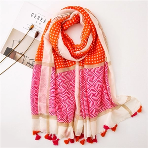 Colorful spliced scarf with orange grid and rose red octagonal patterns and tassels