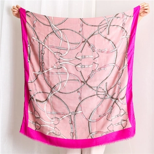 Detail of pink cotton linen scarf featuring luxury horse harness and chain motifs