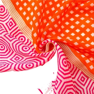 Lightweight scarf featuring orange plaid and fuchsia hexagonal geometric patterns