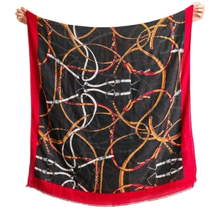Brown cotton-linen square scarf with chain print and red border, hand-stretched view