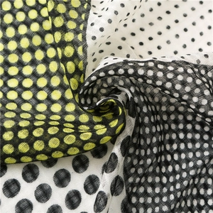 Classic British checkered scarf featuring contrasting yellow and black polka dot patterns
