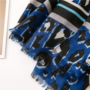 Detailed view of leopard print cotton-linen scarf with fringed edges and stripe pattern