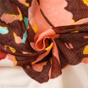 Macro shot of breathable brown butterfly print fabric with woven texture details