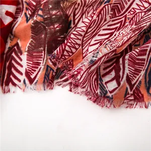 Close-up of bohemian leaf pattern cotton scarf featuring delicate short fringe edges