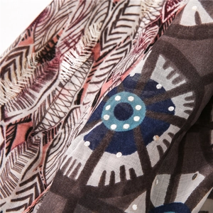 Detailed macro view of cotton linen scarf featuring vintage leaf and mandala patterns