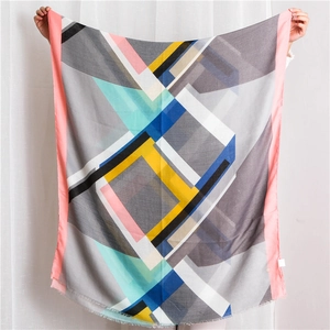 Lightweight cotton-feel shawl with geometric color blocks and delicate fringe edges