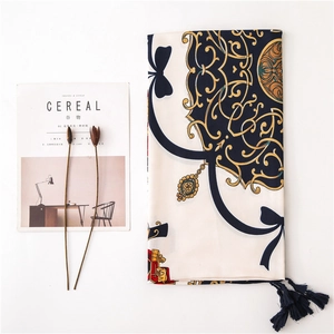 Baroque style silk scarf with golden chain pattern and navy tassels on white background