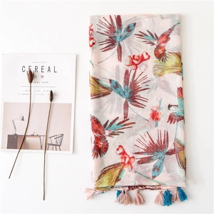 Lightweight pink scarf with colorful bird prints and tropical plant patterns with tassels