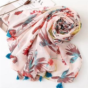 Pink sun protection shawl with golden birds and floral prints featuring colorful tassels