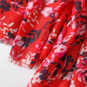 Red cotton linen floral shawl with ethnic patterns and delicate fringe borders