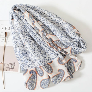 Lightweight white cotton scarf with blue leaf print and bohemian paisley patterns