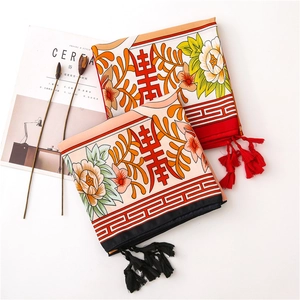 Detail of floral silk scarves with traditional Chinese longevity motifs and tassels