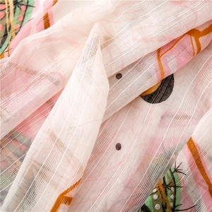 Close-up of lightweight cactus print scarf with breathable textured vertical stripes