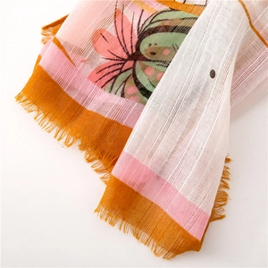 Close-up of lightweight cactus print scarf showing detailed weave and fringe edges