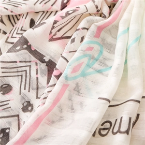 Detail of cotton linen scarf showing breathable weave texture and colorful geometric print