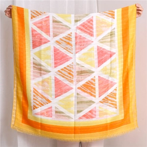 Detail of colorful geometric pattern cotton linen shawl with soft fringe trim
