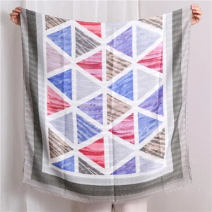 Detail of geometric pattern cotton linen shawl with frayed edges for summer sun protection