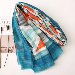 Detailed view of geometric pattern cotton linen scarf with blue and orange color block