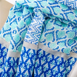 Detail of blue Bohemian cotton scarf featuring damask patterns and ethnic prints