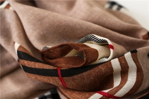 Close-up of soft cotton linen plaid scarf showing thick warm texture and classic check pattern