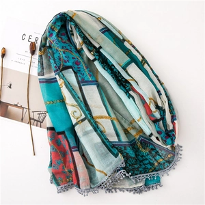Detail of printed cotton linen scarf with vintage chain patterns and gray crochet fringe