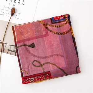 Detailed pattern of chain and tassel prints on lightweight cotton linen beach scarf