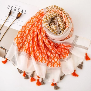 Detail shot of bohemian print linen scarf with tassels and geometric patterns