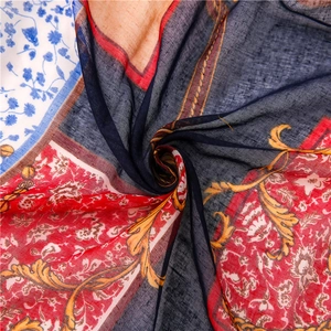 Macro shot of printed cotton linen scarf showing intricate baroque patterns and soft texture