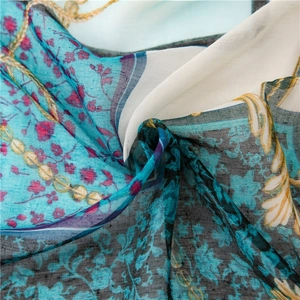 Vintage chain print scarf in turquoise and beige with elegant floral vine patterns