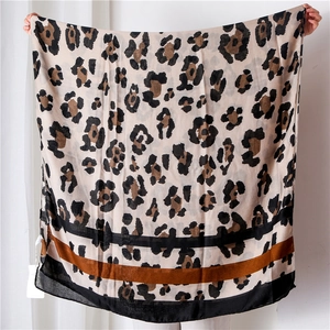 Classic leopard print cotton-linen scarf with wide black border and soft draped texture