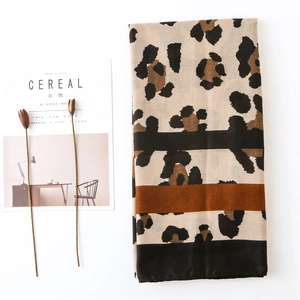 Classic leopard print cotton linen scarf with caramel stripe and black hem detail