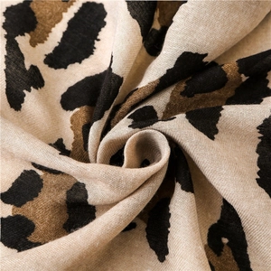 Soft leopard print cotton linen scarf with elegant drape and fine textured weave pattern